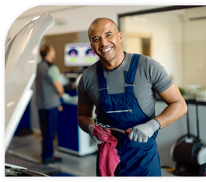 Auto repair garage technician working on a customer's vehicle