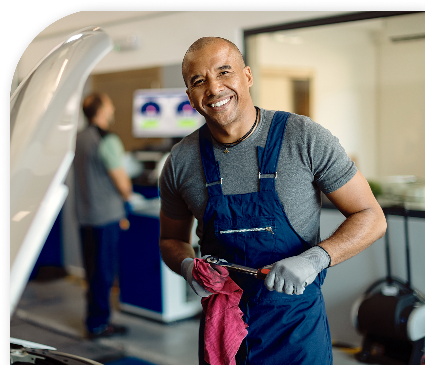 Auto repair garage technician working on a customer's vehicle