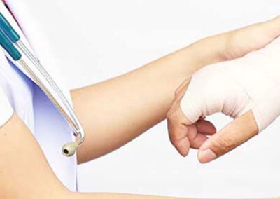 nurse holding injured hand