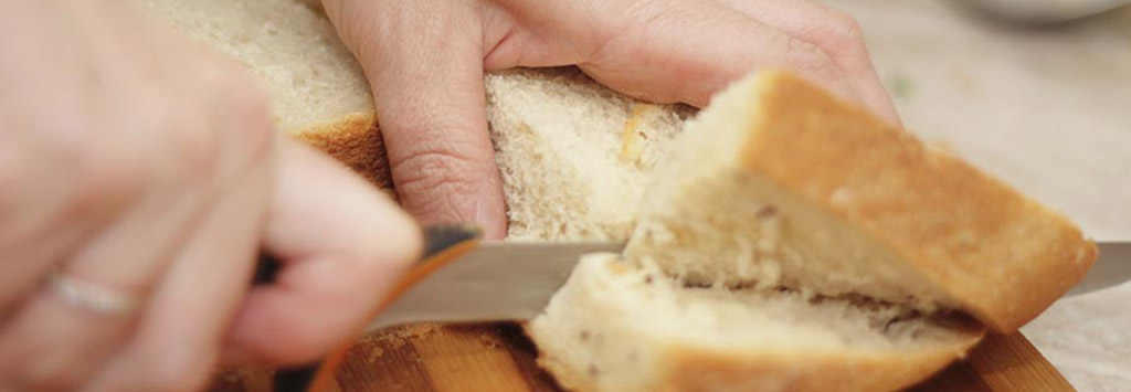 Cutting bread on a cutting board