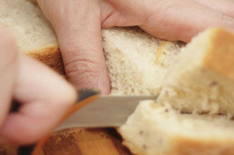 Cutting bread on a cutting board