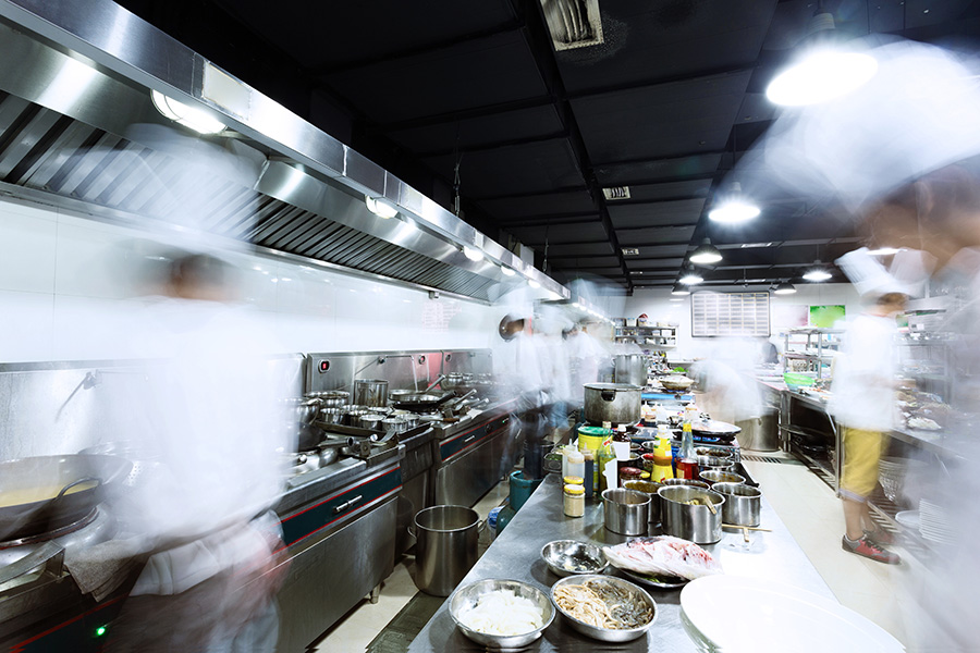 Image of a bustling quick service restaurant kitchen.