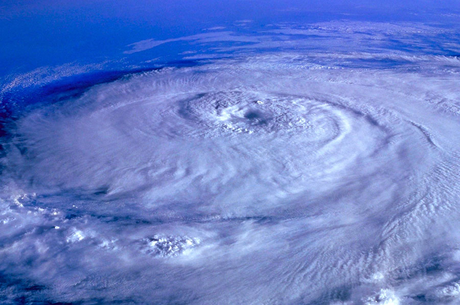 If your business is in an area prone to hurricanes, don’t let 2022’s slow start let you become complacent. To help you prepare for future storms, keep the following information and resources on hand in case you need them.: Image of an aerial view of a hurricane.
