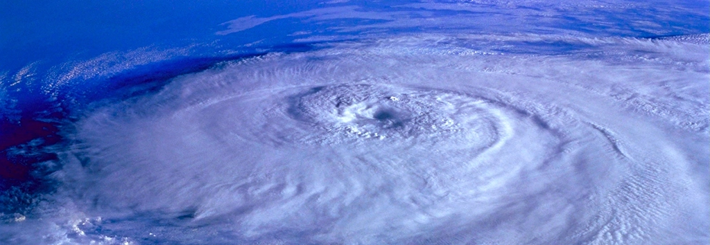 If your business is in an area prone to hurricanes, don’t let 2022’s slow start let you become complacent. To help you prepare for future storms, keep the following information and resources on hand in case you need them.: Image of an aerial view of a hurricane